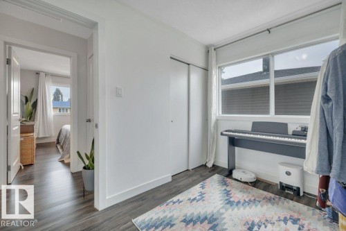Space featuring wood-finish flooring and a white color palette - 7715 73 Avenue, Edmonton, AB - Indoor