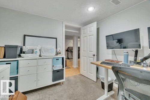 Room featuring recessed lighting, a six-panel interior door, and light gray wall paint - 7715 73 Avenue, Edmonton, AB - Indoor Photo Showing Bedroom