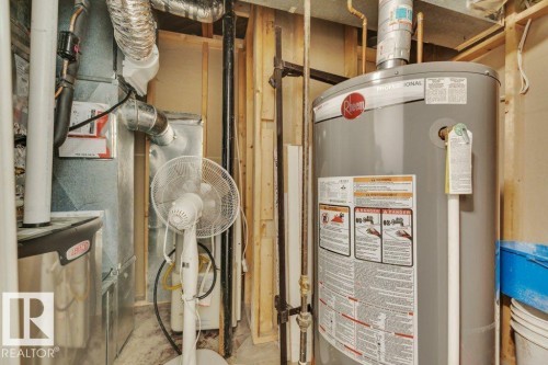 Updated Rheem water heater - 7715 73 Avenue, Edmonton, AB - Indoor Photo Showing Basement