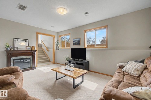 807 Oakland Place, Devon, AB - Indoor Photo Showing Living Room With Fireplace