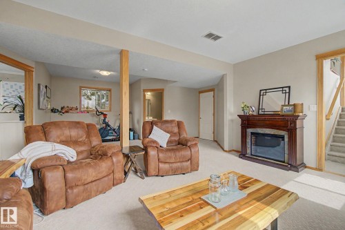 807 Oakland Place, Devon, AB - Indoor Photo Showing Living Room With Fireplace