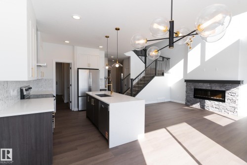 911 18 Avenue, Edmonton, AB - Indoor Photo Showing Kitchen With Fireplace With Upgraded Kitchen