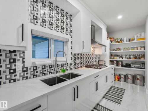 4703 41 Street, Beaumont, AB - Indoor Photo Showing Kitchen With Double Sink With Upgraded Kitchen