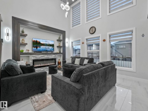 4703 41 Street, Beaumont, AB - Indoor Photo Showing Living Room With Fireplace