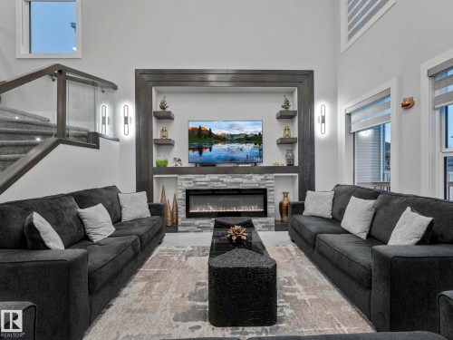 4703 41 Street, Beaumont, AB - Indoor Photo Showing Living Room With Fireplace