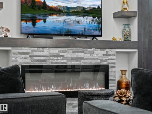 4703 41 Street, Beaumont, AB - Indoor Photo Showing Living Room With Fireplace