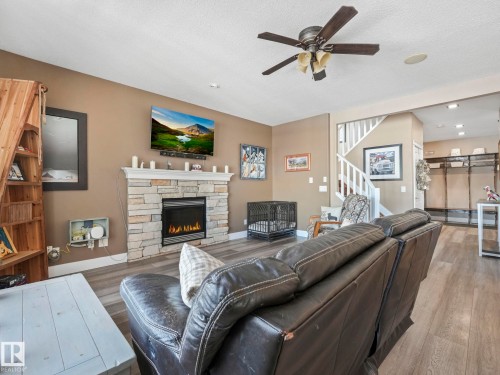 6210 53 Avenue, Beaumont, AB - Indoor Photo Showing Living Room With Fireplace
