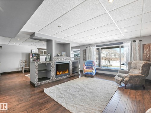 6210 53 Avenue, Beaumont, AB - Indoor Photo Showing Living Room With Fireplace