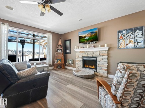 6210 53 Avenue, Beaumont, AB - Indoor Photo Showing Living Room With Fireplace