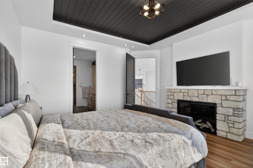 16615 32 Avenue, Edmonton, AB - Indoor Photo Showing Bedroom With Fireplace