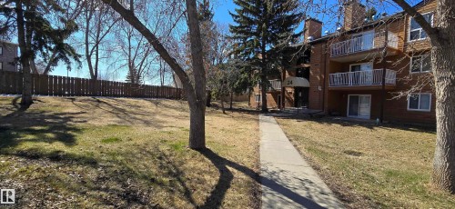 Three-story building with brick and wood-siding exterior - 202 24 Alpine Place, St. Albert, AB - Outdoor