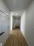 Welcoming entryway featuring light-toned flooring, white walls, and recessed lighting - 2012 210 St, Edmonton, AB  - Indoor Photo Showing Other Room 