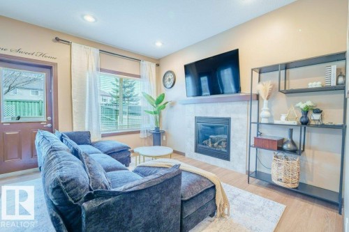 11904 22 Avenue, Edmonton, AB - Indoor Photo Showing Living Room With Fireplace