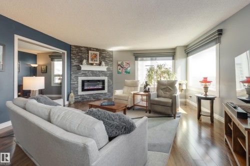 1406 12303 Jasper Avenue, Edmonton, AB - Indoor Photo Showing Living Room With Fireplace
