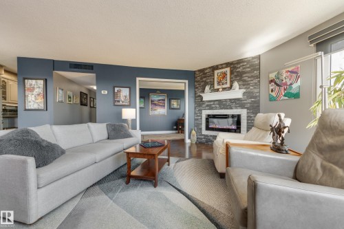 1406 12303 Jasper Avenue, Edmonton, AB - Indoor Photo Showing Living Room With Fireplace