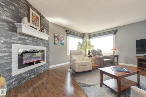 1406 12303 Jasper Avenue, Edmonton, AB - Indoor Photo Showing Living Room With Fireplace