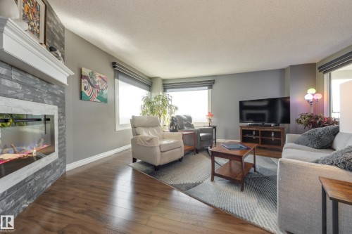 1406 12303 Jasper Avenue, Edmonton, AB - Indoor Photo Showing Living Room With Fireplace