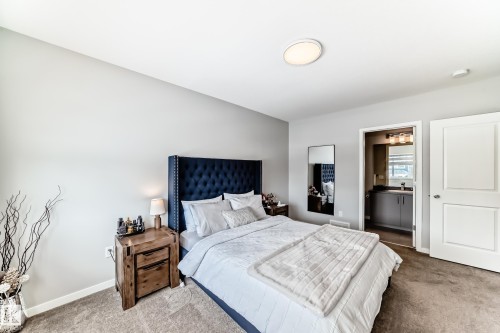 This room features light gray walls and a carpeted floor - 2329 82 Street, Edmonton, AB - Indoor Photo Showing Bedroom