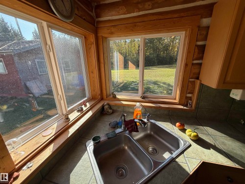 Corner double-pane windows with natural wood trim - 63218 Range Road 254, Rural Westlock County, AB 