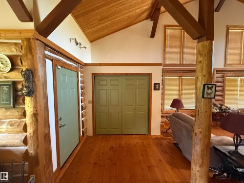 Vaulted ceiling featuring exposed wood beams and wood-finish flooring - 63218 Range Road 254, Rural Westlock County, AB 