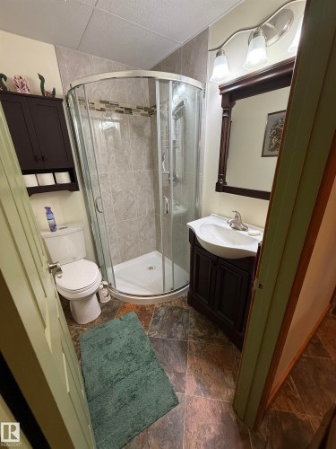 Curved glass shower enclosure with tile surround and mosaic accent band - 63218 Range Road 254, Rural Westlock County, AB 