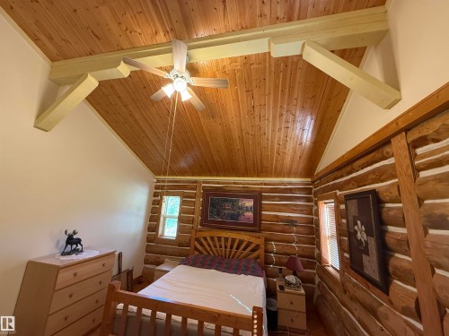 Vaulted wood plank ceiling with exposed light-colored beams and a ceiling fan - 63218 Range Road 254, Rural Westlock County, AB 