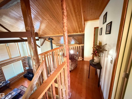 Upper-level hallway featuring wood-finish flooring and white walls - 63218 Range Road 254, Rural Westlock County, AB 