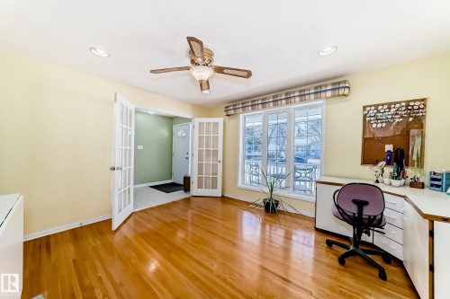 Spacious room featuring wood-finish flooring, recessed lighting, and a ceiling fan - 17 Springfield Crescent, St. Albert, AB - Indoor Photo Showing Office