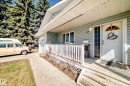 Front entry porch featuring light blue siding and white trim - 17 Springfield Crescent, St. Albert, AB  - Outdoor 