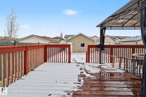 Spacious wood deck with red railing and partially covered gazebo - 11633 167B Avenue, Edmonton, AB - Outdoor With Deck Patio Veranda With Exterior
