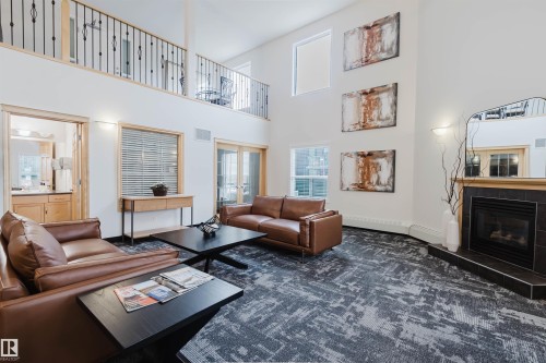 204 1320 Rutherford Road, Edmonton, AB - Indoor Photo Showing Living Room With Fireplace