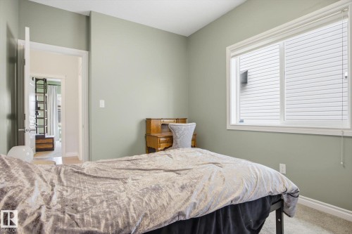 Neutral-toned room featuring light green walls and carpeting - 28 Hewitt Circle, Spruce Grove, AB - Indoor Photo Showing Bedroom
