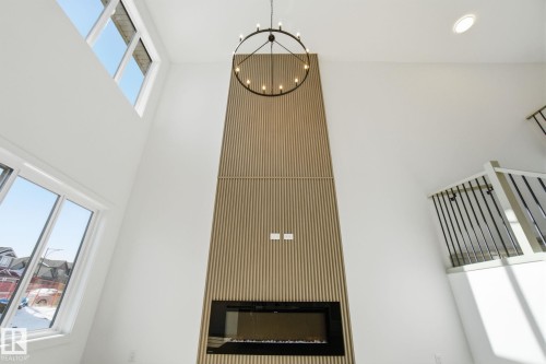 1407 Osprey Crest, Edmonton, AB - Indoor Photo Showing Other Room With Fireplace