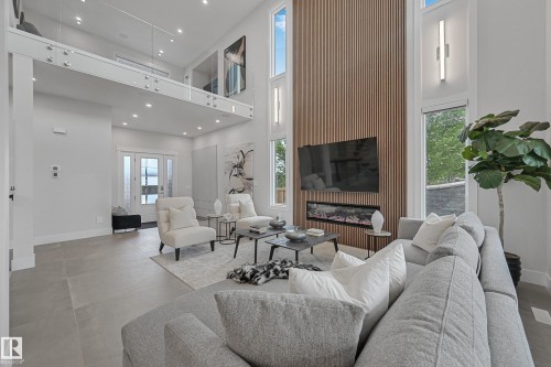 5121 Woolsey Link, Edmonton, AB - Indoor Photo Showing Living Room With Fireplace