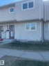 Two-story townhome featuring light-colored siding and stucco exterior - 5625 137 Avenue, Edmonton, AB  - Outdoor 