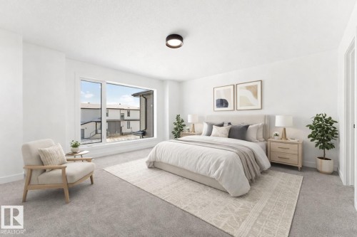 The bedroom features a large window, light-colored carpeting, and a modern ceiling light fixture - 94 Blackbird Bend, Fort Saskatchewan, AB - Indoor Photo Showing Bedroom