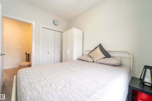 Neutral wall paint tones complement the carpeted flooring - 117 804 Welsh Drive, Edmonton, AB - Indoor Photo Showing Bedroom