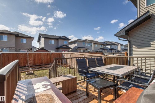 Spacious wood-finish deck with metal railings - 9812 224 Street, Edmonton, AB - Outdoor With Deck Patio Veranda With Exterior