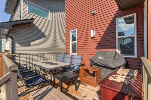 Outdoor deck space featuring wood-finish decking and a sturdy railing system - 9812 224 Street, Edmonton, AB - Outdoor With Deck Patio Veranda With Exterior