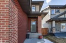 Contemporary exterior with red brick and horizontal siding accents - 9812 224 Street, Edmonton, AB  - Outdoor 