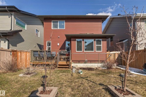 Rear exterior with red horizontal siding and a dark brown trim - 9812 224 Street, Edmonton, AB - Outdoor