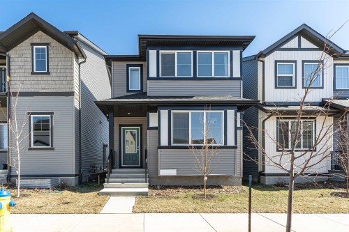 Contemporary two-story residence featuring a gray and off-white exterior with dark trim - 3367 Erlanger Bend, Edmonton, AB - Outdoor With Facade