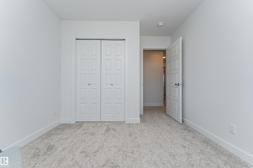 Neutral-toned carpet flooring and white walls - 3367 Erlanger Bend, Edmonton, AB - Indoor