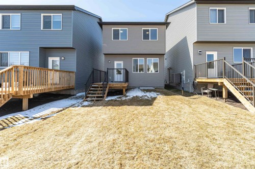 Gray vinyl siding exterior featuring multiple windows - 3367 Erlanger Bend, Edmonton, AB - Outdoor