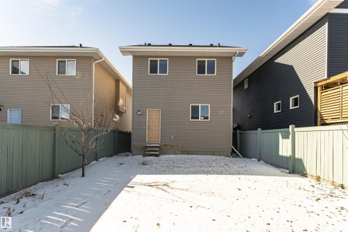 Two-story exterior with light brown siding and white trim - 16420 15 Avenue, Edmonton, AB - Outdoor With Exterior