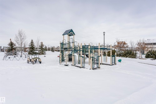 Community park featuring a multi-level playground structure, geodesic dome climber, and open green space - 16420 15 Avenue, Edmonton, AB - Outdoor
