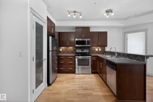 105 10121 80 Avenue, Edmonton, AB - Indoor Photo Showing Kitchen With Stainless Steel Kitchen