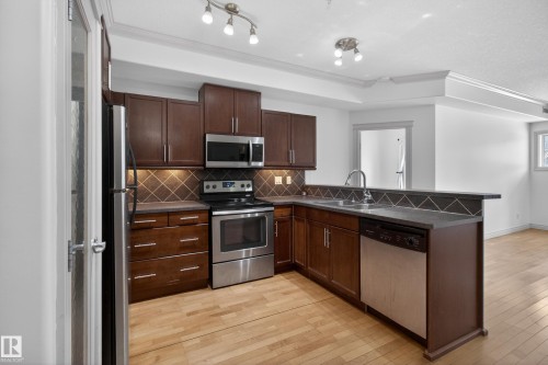 105 10121 80 Avenue, Edmonton, AB - Indoor Photo Showing Kitchen With Stainless Steel Kitchen With Double Sink