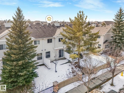 The property features a private fenced yard with a sliding glass door for outdoor access - 175 150 Edwards Drive, Edmonton, AB - Outdoor