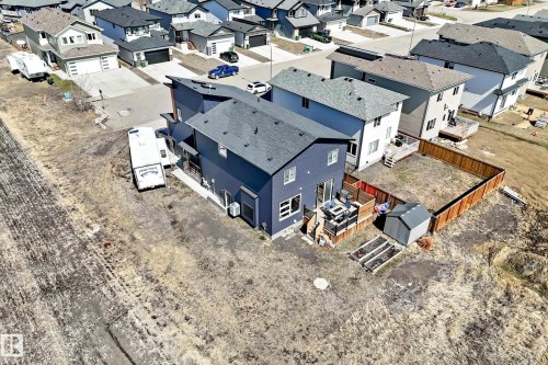 Modern two-story residence featuring dark blue siding and a dark shingled roof - 5263 47 Ave, Calmar, AB - Outdoor